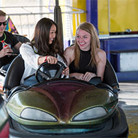 Image of attendees in bumper cars.