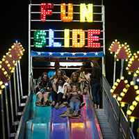 Image of attendees going down the giant slide.