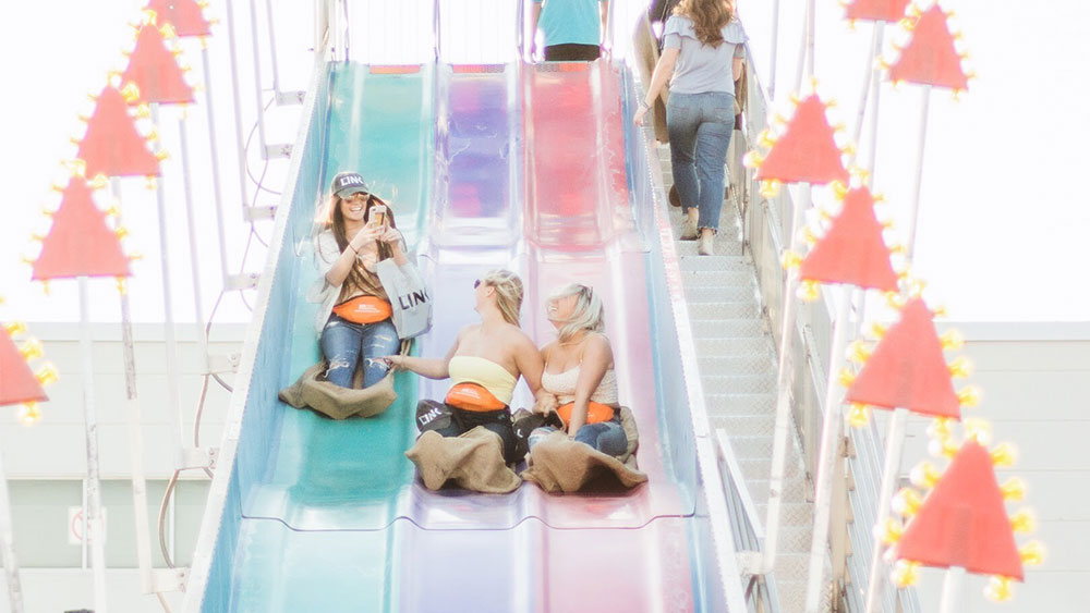 Image of attendees going down the giant slide.