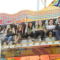 Image of attendees on a carnival ride.