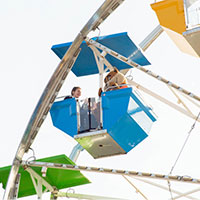 Image of attendees on a Ferris Wheel.