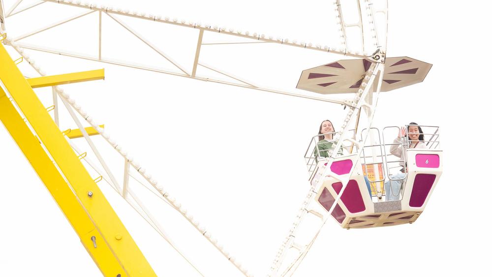 Image of attendees on a Ferris wheel